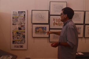 ToonSeum Vice President John Kelly explains that many of the political cartoons in the exhibit were created by Executive Board Director and Post-Gazette Cartoonist, Rob Rogers
